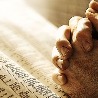 Hands Praying on Bible Facebook Cover - Religion